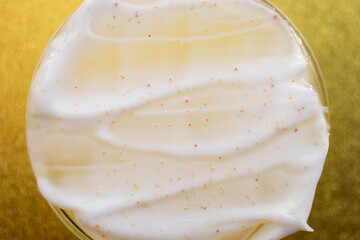 Closeup photography of cosmetic scrub on petri dish.