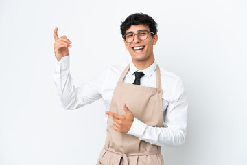 Restaurant Argentinian waiter isolated on white background making guitar gesture