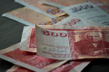 Close up of five hundred Kronur bill and another banknotes. Selective focus. Icelandic currenly