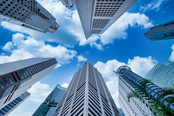 Fototapeta na wymiar Modern buildings on blue sky in downtown at Singapore.
