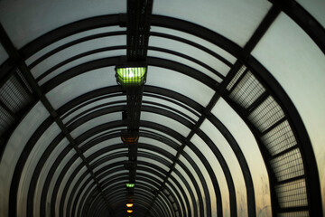 Tunnel in evening. Lamps in pedestrian crossing. Architecture details.