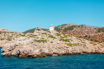 Fototapeta na wymiar Windmill on the island of Symi in Greece