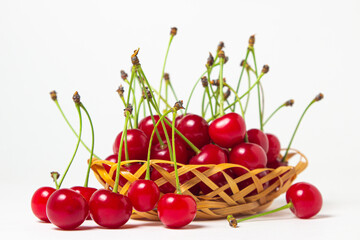 Cherry in a basket on a white background. Fresh ripe cherry. summer fruit