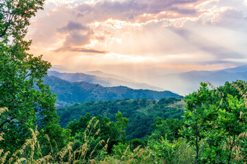 Mountain valley during sunset or sunrise. Natural spring or summer season landscape