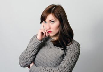 Portrait of a woman on a light background