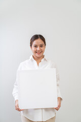Fototapeta premium Asian women holding white board. Advertising copyspace
