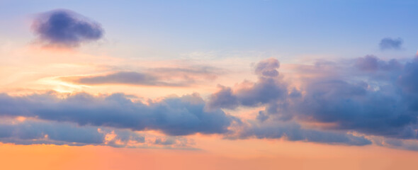 Panorama of Majestic pastel sunrise sundown sky background with dramatic colorful clouds