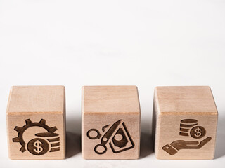 Symbols on wood blocks as concept of financial management