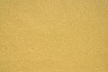 黄色いざらざらした壁の背景素材	