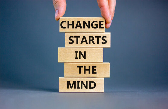 Change starts in the mind symbol. Concept words Change starts in the mind on wooden blocks on a beautiful grey table grey background. Business motivational and change starts in the mind concept.