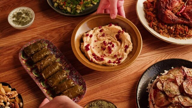 Arabian cuisine. Turkish traditional food. Kabsa, maqluba, dolma, tabbouleh close-up, rice and meat dish, middle eastern national food. Muslim family dinner, Ramadan, iftar. 