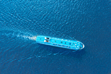 Aerial view of floating ship colorful landscape with boat in marina bay, blue sea. Top aerial view...