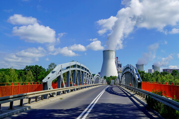 bridge to green transition, modern coal power plant and bridge leading to the facility,