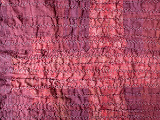 stitched back side of crinkled red silk scarf