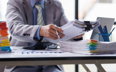 Business Documents, Auditor businesswoman checking searching document legal prepare paperwork or report for analysis TAX time,accountant Documents data contract partner deal in workplace office