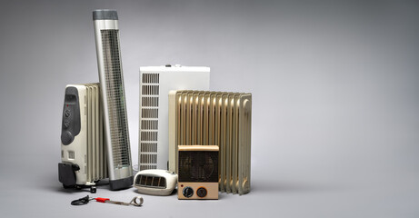 Group of different heaters (infrared, oil, radiator, fan). Heating, energy crisis and consumption concept