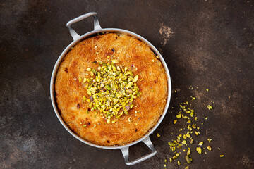 Traditional Arabian Kanafe with Cream and Cheese with pistachio nuts