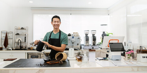 Startup successful small business owner sme handsome asian man drip hot water in to filter paper coffee slow bar in cafe. Portrait young man barista cafe owner SME entrepreneur blogger business banner