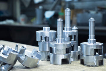 Metal products turned on a CNC milling machine, metalworking close-up at the factory