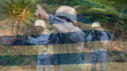 Animation of flag of uruguay over diverse male soldiers with weapon - Powered by Adobe
