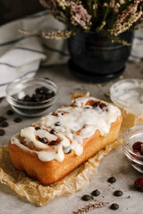 Cinnabons rolls with great cream on it and a beautiful background