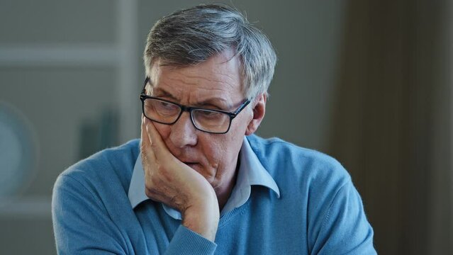 Portrait indoor in office home old thoughtful pensive confused senior man feel worried think memory problem take off glasses forgotten information, elderly old teacher look away anxious about trouble