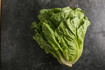 Healthy food, green leaf lettuce salad top view