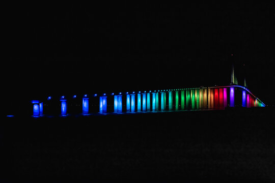LGBTQ  rainbow colors illuminate Skyway Bridge.