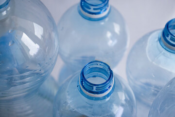 Empty plastic bottle blue background
