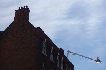 A cherry picker over rooftops. Kingston upon Hull
