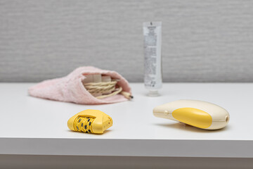 electric epilator lies on a white background