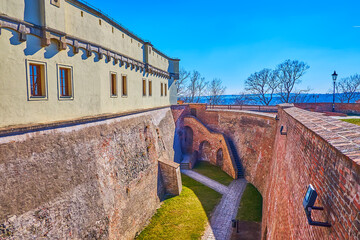 The deep moat and high impregnable wall of Spilberk fortress in Brno, Czech Republic