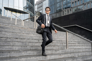 Financier with glasses man goes to work in the office