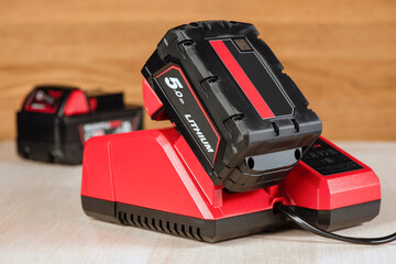 The process of charging a lithium battery from a cordless construction tool. The battery from the...