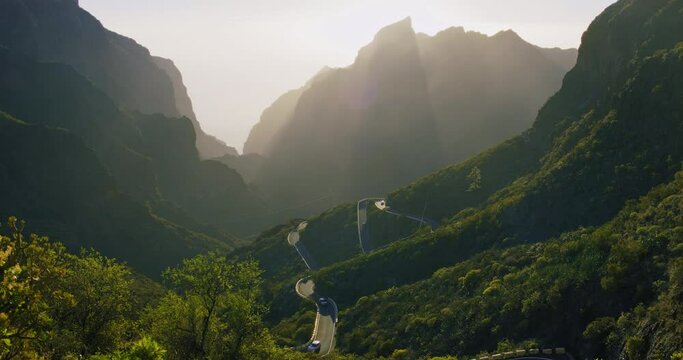 Sunset in Masca Valley Park and Gorge, Tenerife, Canarian Islands, Spain. Beautiful view of the mountain range and the rays of the setting sun.