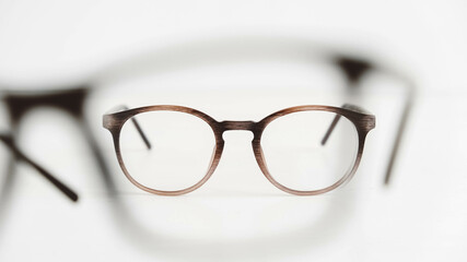 Optical glasses of different shapes on a white background