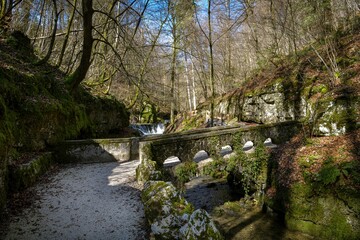 Fototapeta na wymiar Stone bridge across Verena stream in Verena gorge in Switzerland