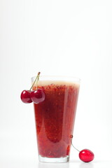 cherry drink and bunch of cherries on white background, cold drink, space for text