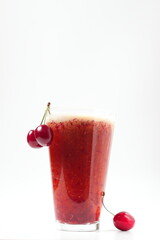 cherry drink and bunch of cherries on white background, cold drink, space for text