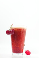 cherry drink and bunch of cherries on white background, cold drink, space for text