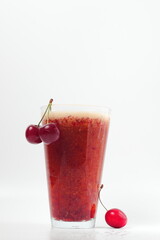 cherry drink and bunch of cherries on white background, cold drink, space for text