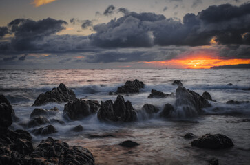 Obraz premium Sunrise on Reis Magos beach. Canico, Madeira, Portugal. October 2021. Long exposure picture