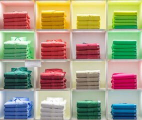 Polo t-shirt store interior. Shop shelves with  colored fashion cotton shirt
