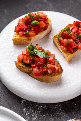 italian bruschetta with fresh tomatoes, basil, garlic, olive oil and cheese
