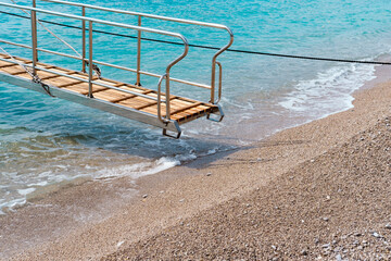 Ladder welcome on board to boat, gulet, daily rent trip by sea, shore, pebble beach, beautiful...