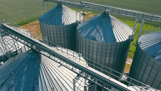 Granary elevator for export wheat, Silos agro plant for processing drying cleaning, storage of agricultural products grain. Large iron terminal of grain