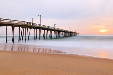 Beautiful sunrise at Nags Head Pier, Outer Banks, North Carolina, USA.  Nags Head is one of the most popular beach of the outer Banks for its  wealth of amenities, sprawling ocean and soundfront view