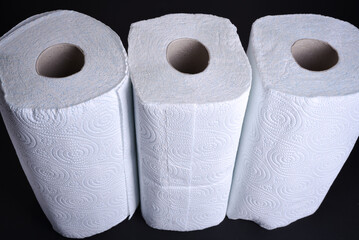 Close up view of two rolls of white kitchen towels