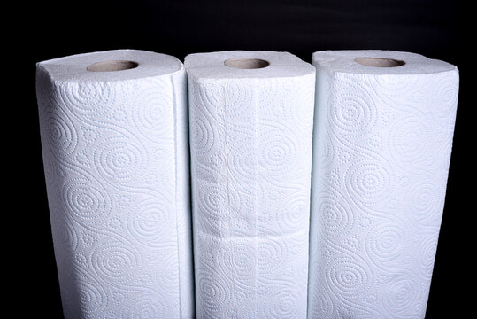 Close up view of two rolls of white kitchen towels