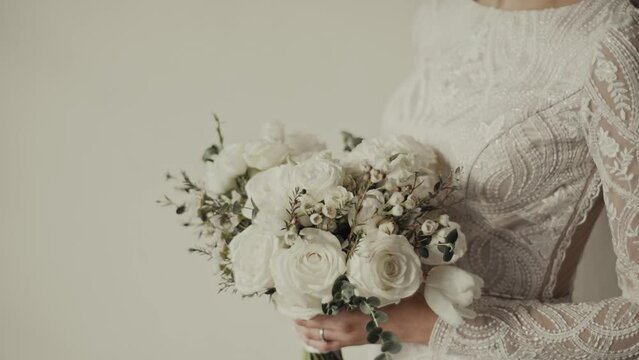 Bride's photo shoot. Luxurious wedding bouquet in a rustic style in the hands of the bride. Close-up.
